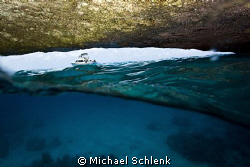 The view of inside looking out of "The Blue Cave" Curacao... by Michael Schlenk 